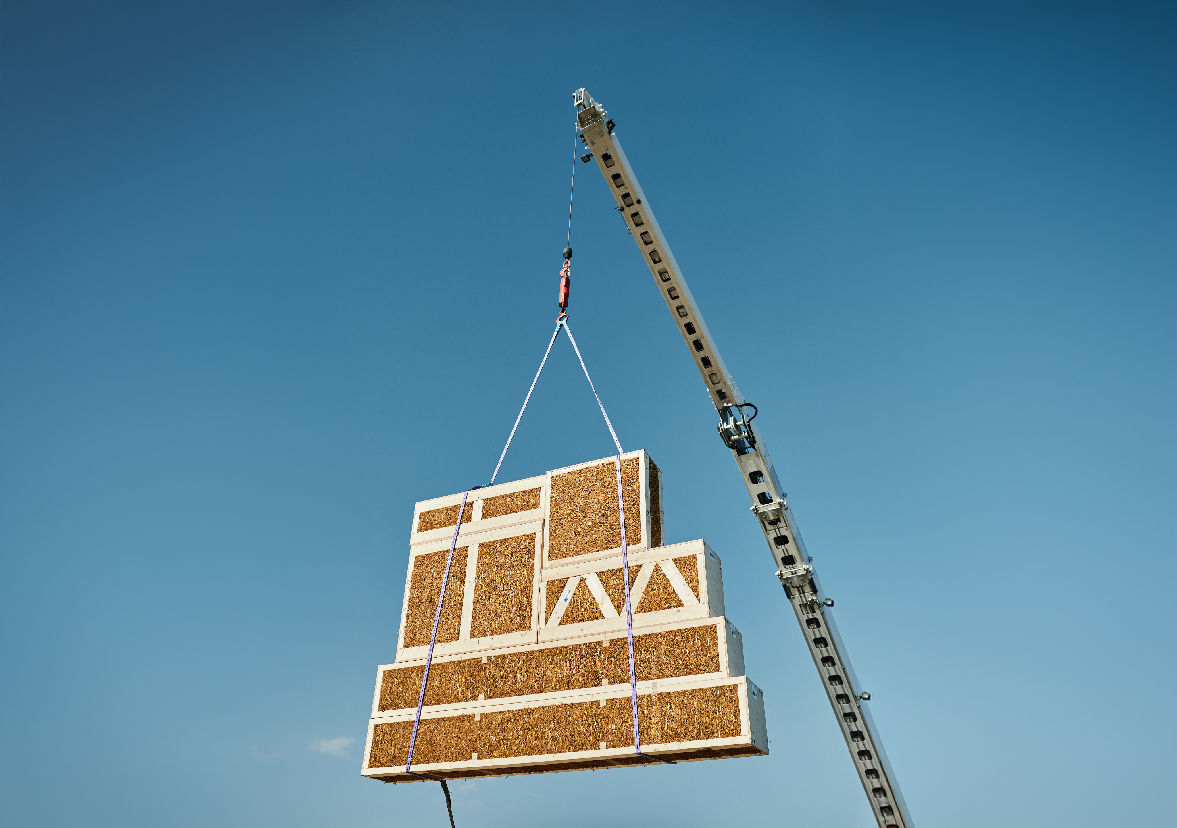 EcoCocon panels being craned into position on a construction site