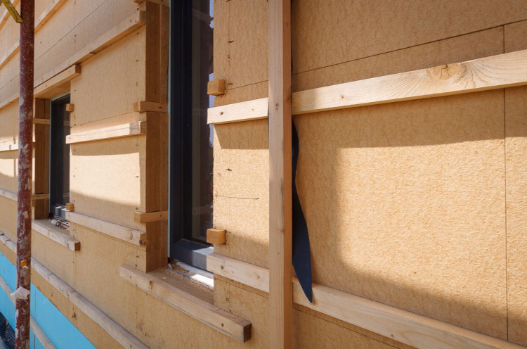 Exterior wall with wood fibre boards installed.